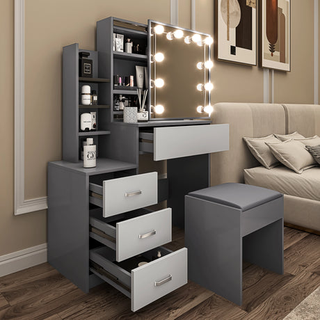 Gray vanity with mirror and lights in a room with a sofa and decor.