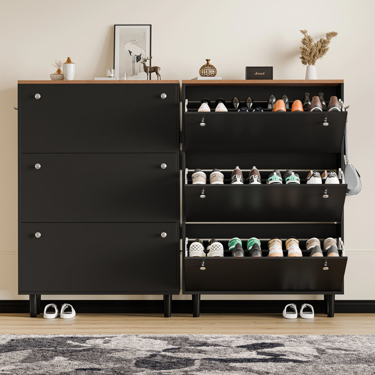 Two black shoe cabinet units with three Pull-down drawers each, one open showing shoes, bag hanging, oak decor on top.