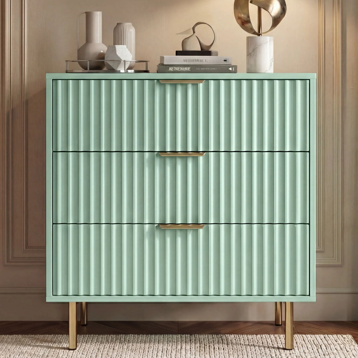Green Flutrina 3 drawer chest with vertical ribbed finish and golden metal support legs showing the sturdy base