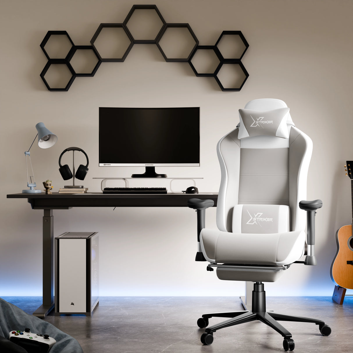 Modern gaming setup with a white gaming chair, desk, and monitor in a room.