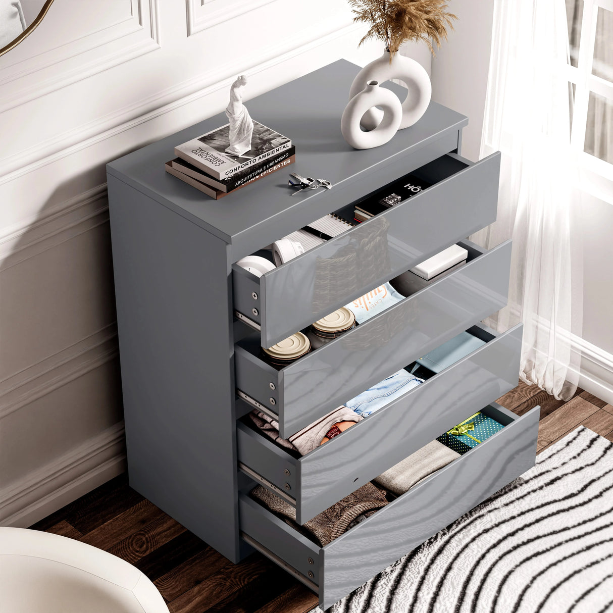Open grey High Gloss 4 Drawer Chest of Drawers filled with clothes and accessories, ideal for organized bedroom storage.