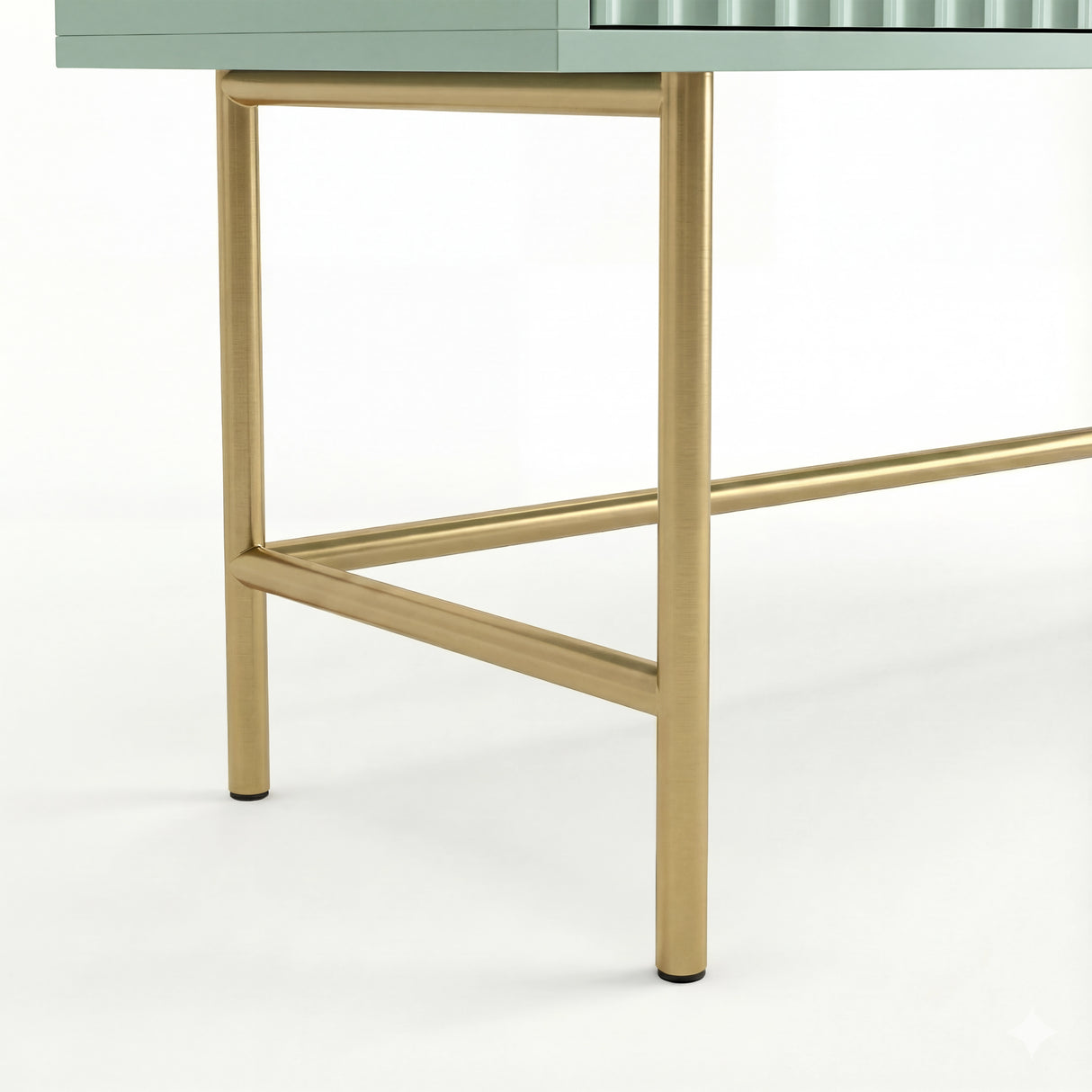 Close-up of the sturdy gold metal legs of a modern vanity dressing table in flutrina design, supporting its structure