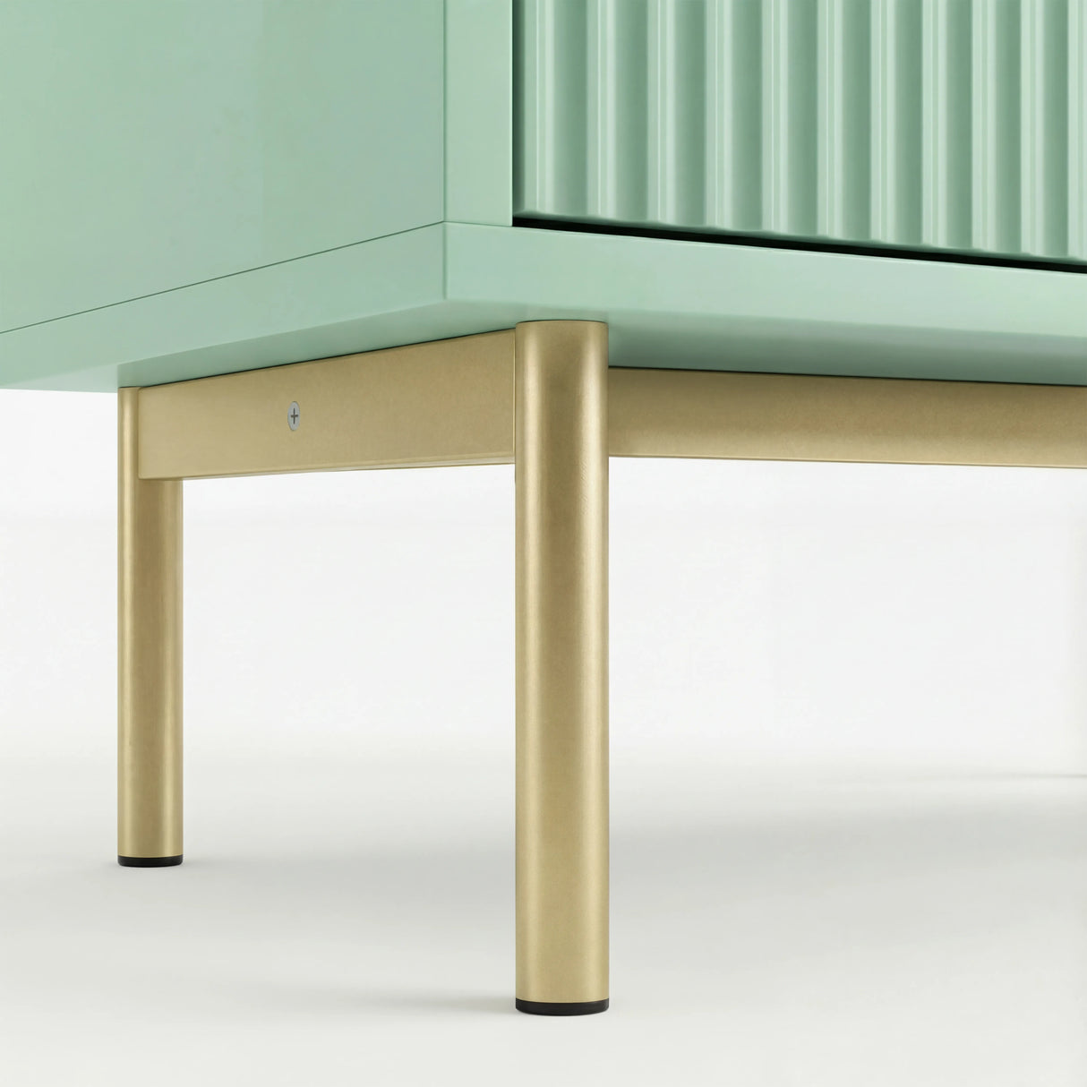 Green 6 drawer wide chest standing on golden metal legs with raised base and sturdy frame