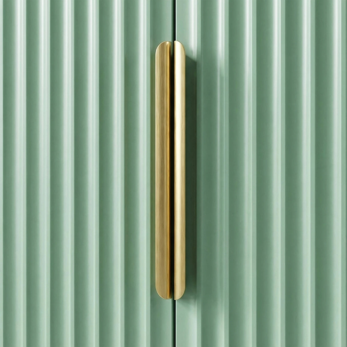 Close detail of green wardrobe vertical metal handle against painted surface
