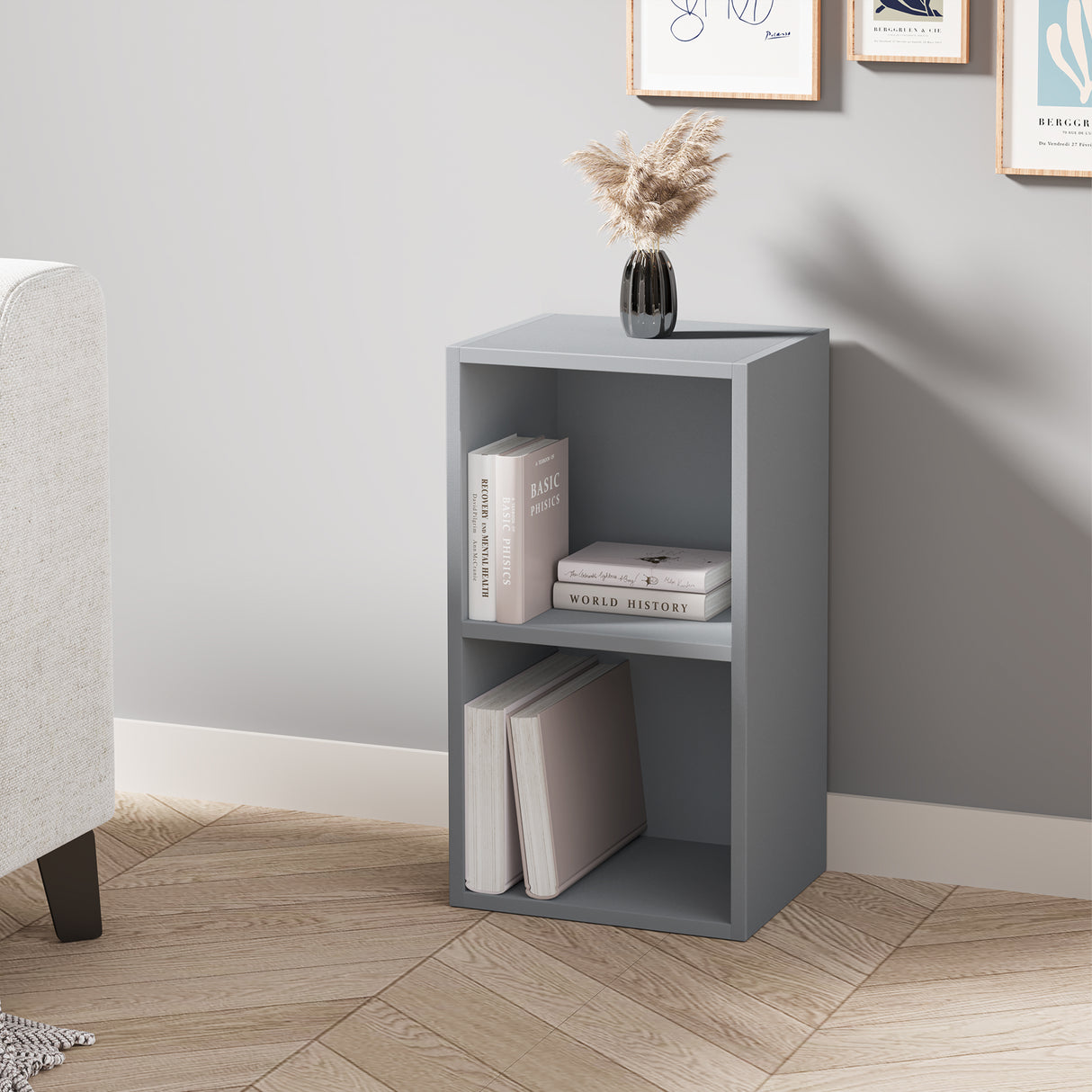 angled front view of grey cube shelving unit with light decor and books, offering a stylish touch to small interiors