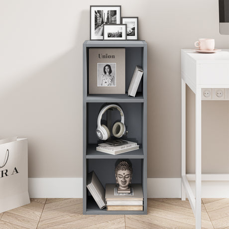 front view of grey free standing shelves with books and art, adding a sleek storage solution