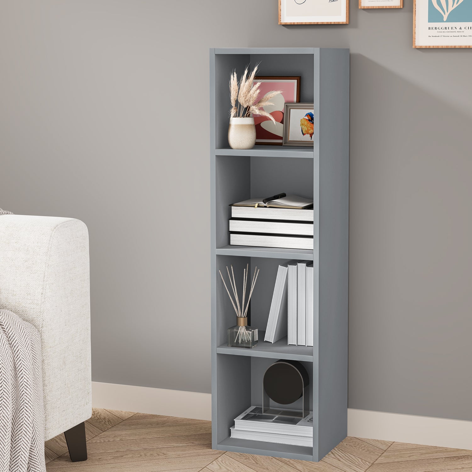 angled front view of 4 tier grey shelving unit styled with books and decorative items for a modern home