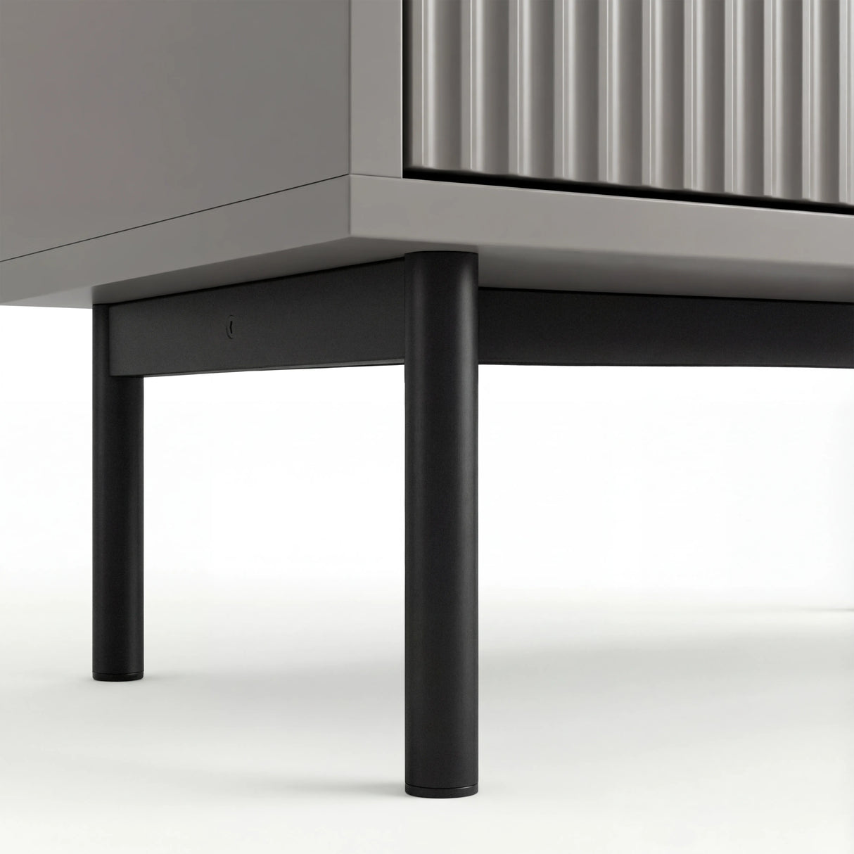 Grey 5 drawer chest, lower section showing silver metal legs and corner frame construction