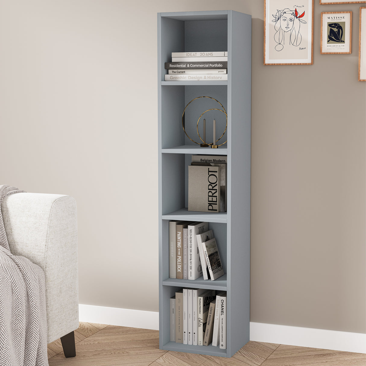 angled front view of 5 tier grey tall bookshelf decorated with books and art for elegant storage
