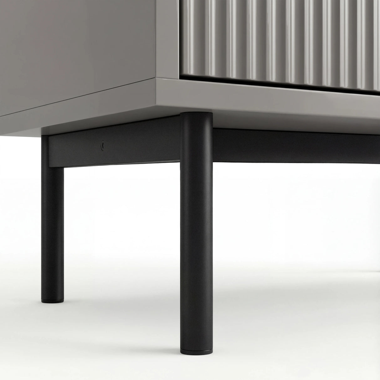 Grey 6 drawer wide and deep chest elevated on slim black metal legs with a stable base structure