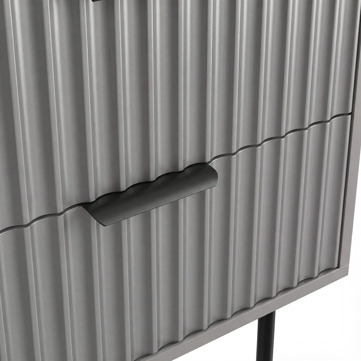 Close detail of the black metallic handle fixed to the grey flutrina design drawer surface of a nightstand