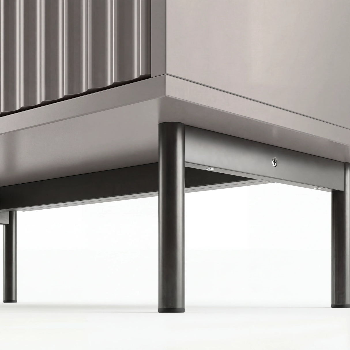 Grey bedroom drawers base detail highlighting raised black metallic legs in modern and stylish design