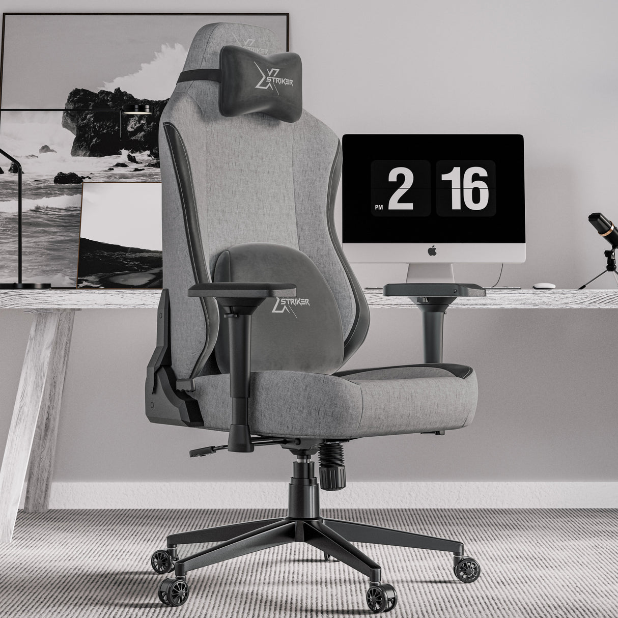 Xstriker Ergonomic Fabric Reclining Gaming Chair with 4D Armrest for Adults in grey, placed in a modern home office setup with a desktop computer and accessories.