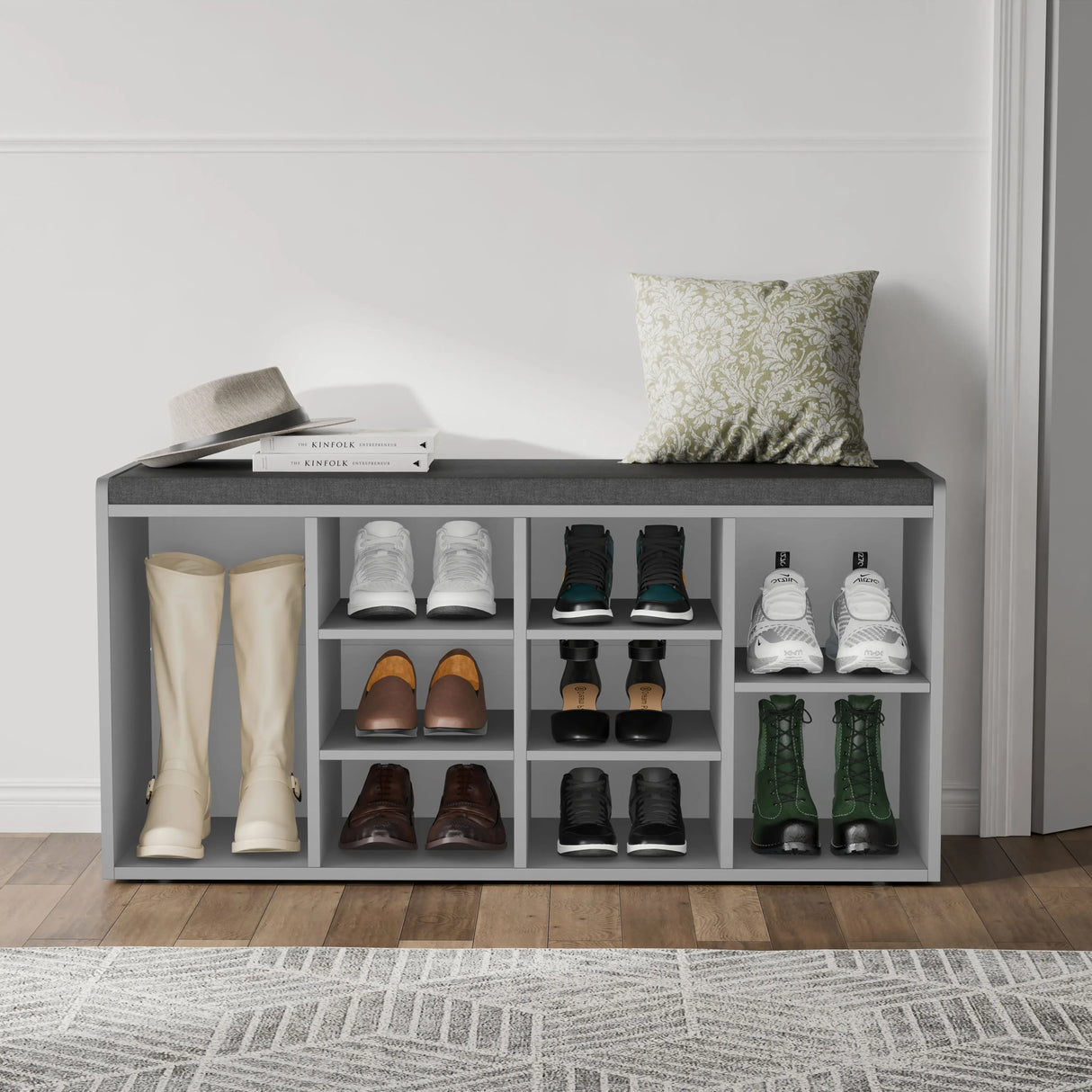Hallway shoe storage bench with cushion and adjustable shelves in grey, featuring 9 compartments for organized footwear storage and a soft seating top.