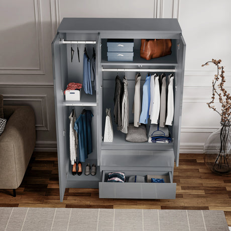 Inside view of grey 3 door wardrobe with shelves, drawers, and hanging rails, designed for efficient clothing and accessory storage.