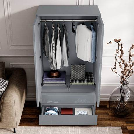 Interior of grey high gloss 2 door wardrobe with hanging rail and drawers, part of the 3 piece bedroom furniture set.
