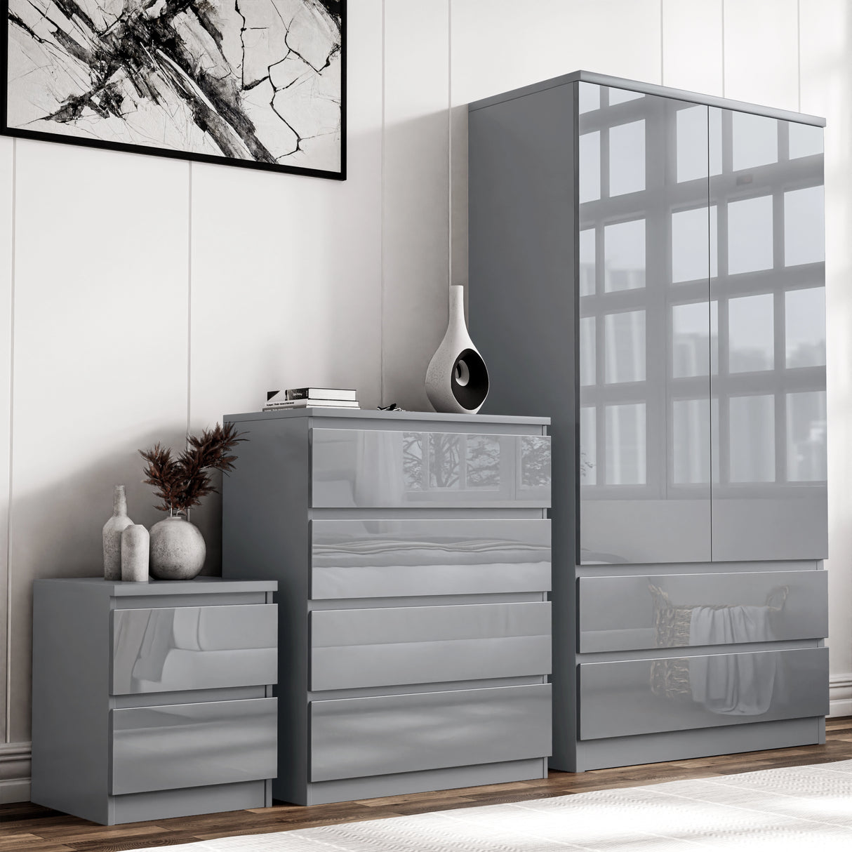 Grey High Gloss 3 Piece Wardrobe Set With Chest of Drawers including wardrobe, chest, and bedside table in a modern bedroom.