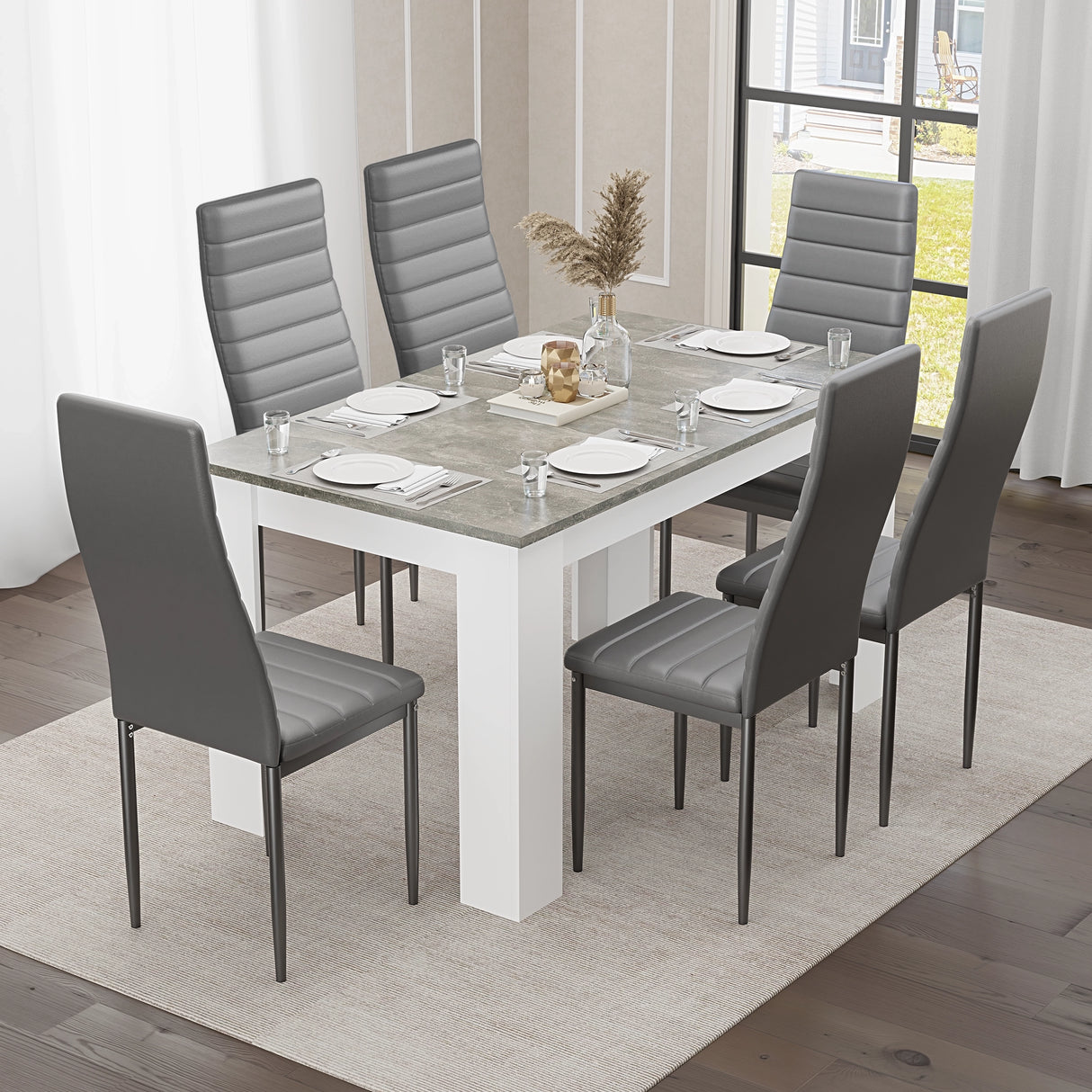 Grey Marble Finish 4-6 Seater Dining Table and Chairs Set with grey faux leather chairs in a modern dining room. Ideal for contemporary kitchens.