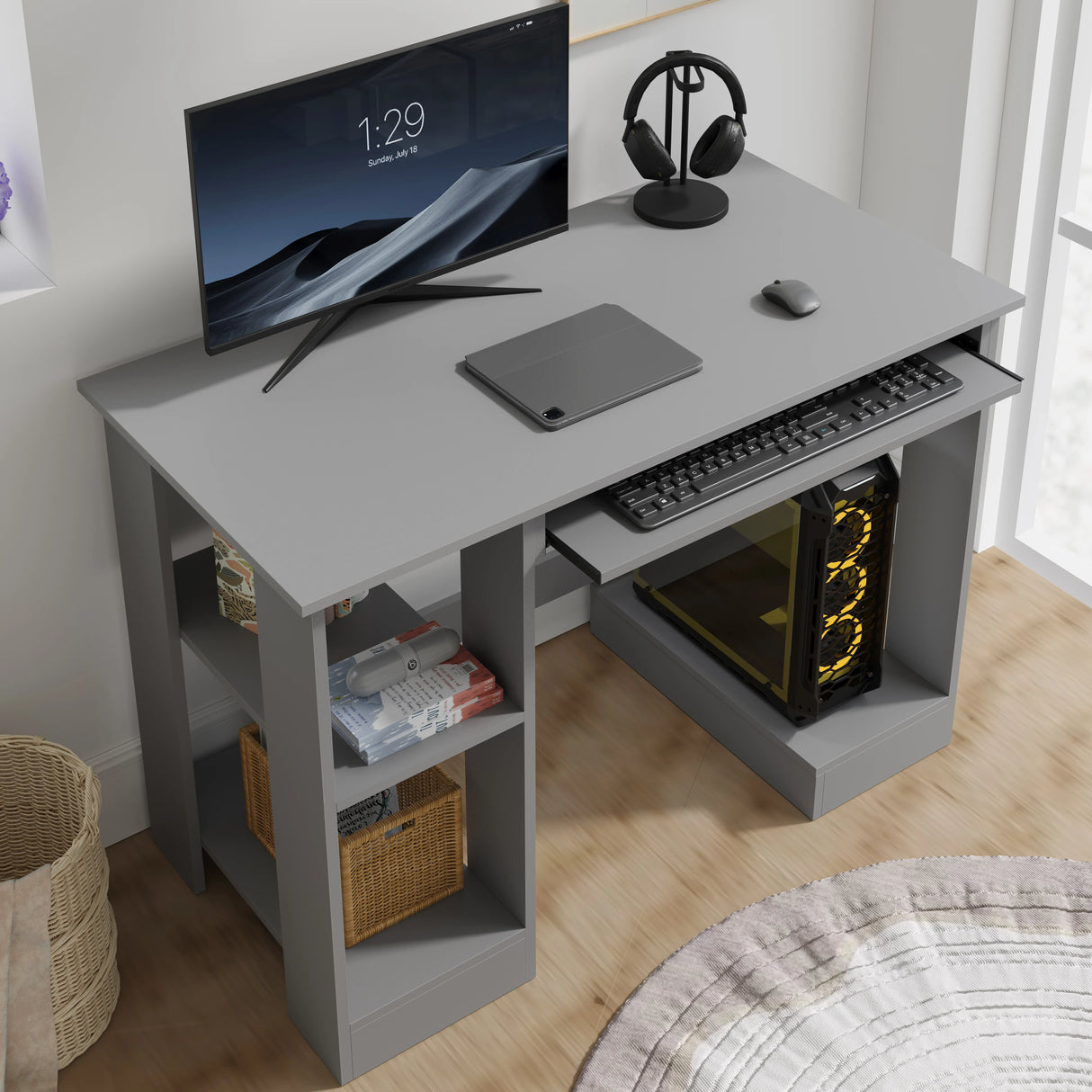 Home office computer desk with shelves in grey featuring a pull-out keyboard tray, monitor, and PC tower setup. Ideal for working, reading, and gaming.
