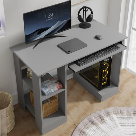 Home office computer desk with shelves in grey featuring a pull-out keyboard tray, monitor, and PC tower setup. Ideal for working, reading, and gaming.