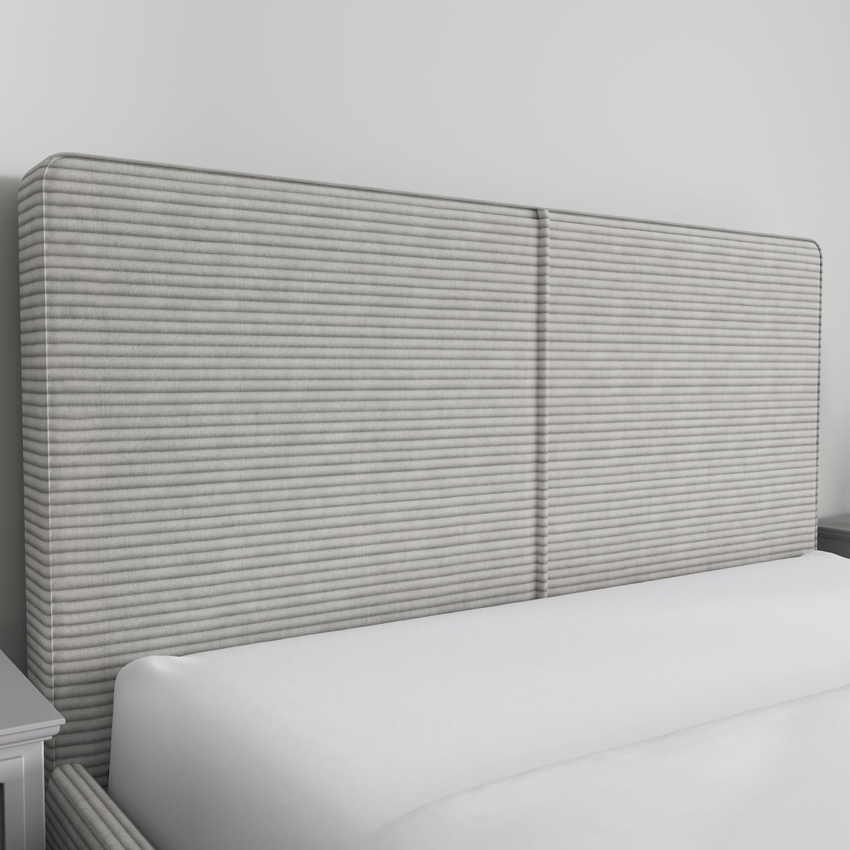 Corduroy ribbed velvet upholstered ottoman bed frame in light grey with tall padded headboard. Ideal for modern bedrooms with hidden storage.
