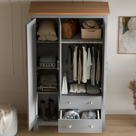 Interior view of grey Shaker Triple Wardrobe With Shelves And Drawers showing hanging rail, shelves, and drawers for efficient bedroom organisation.