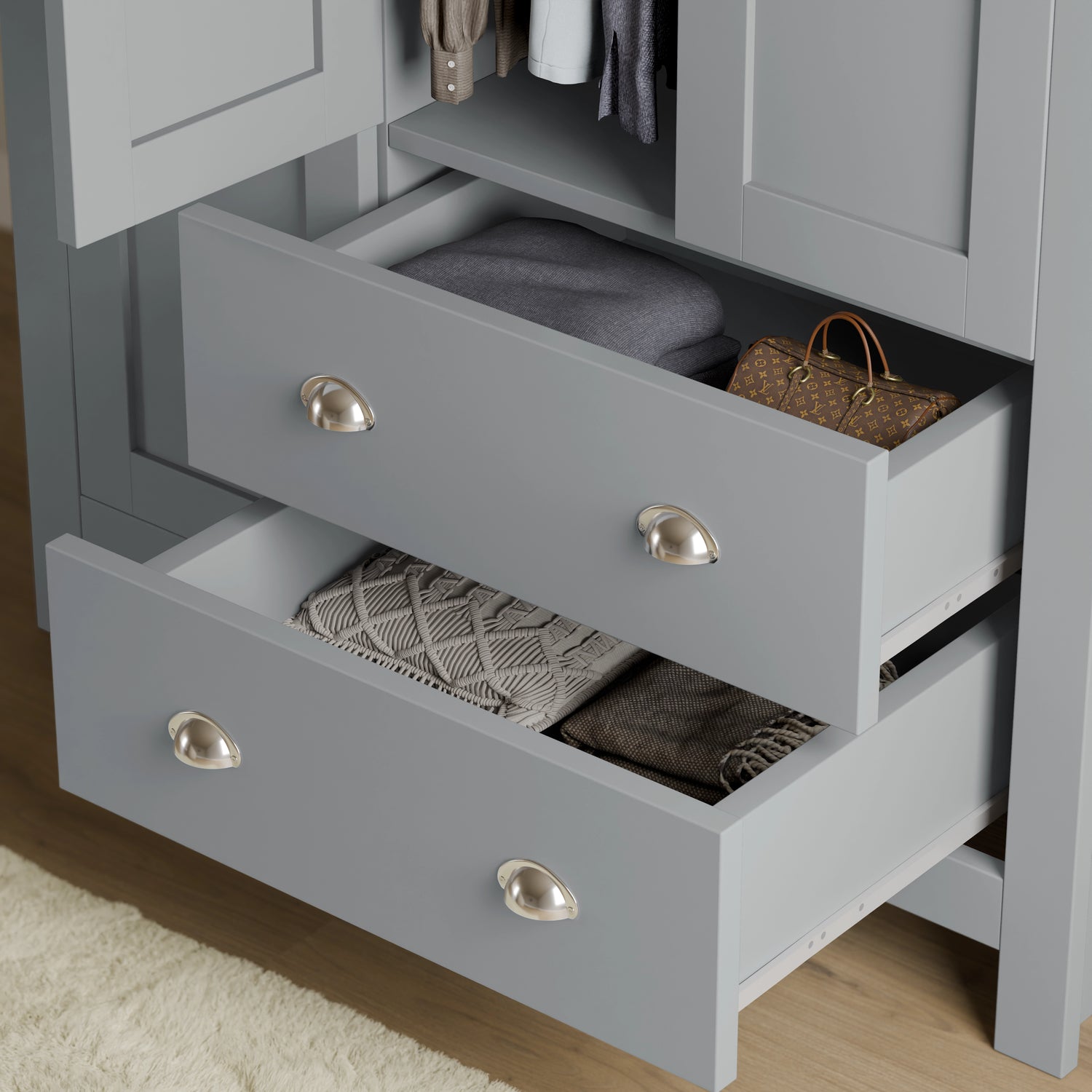 close-up of grey shaker wardrobe drawers with brushed metal handles, showing deep storage for clothes and accessories