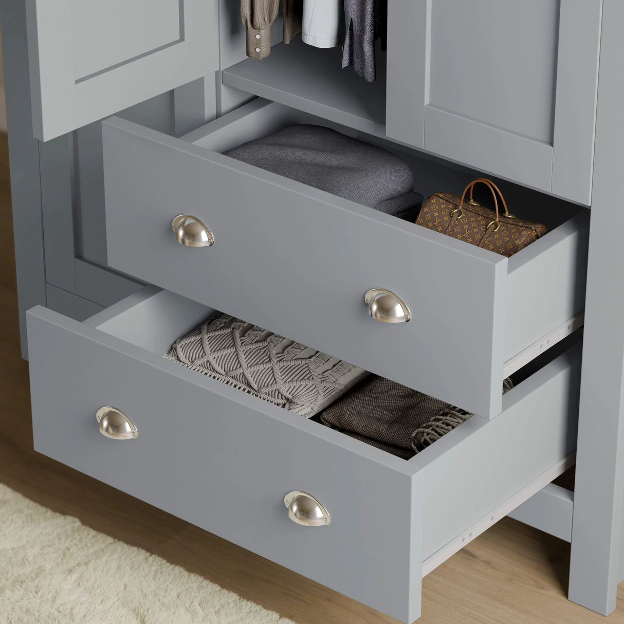 close-up of grey shaker wardrobe drawers with brushed metal handles, showing deep storage for clothes and accessories