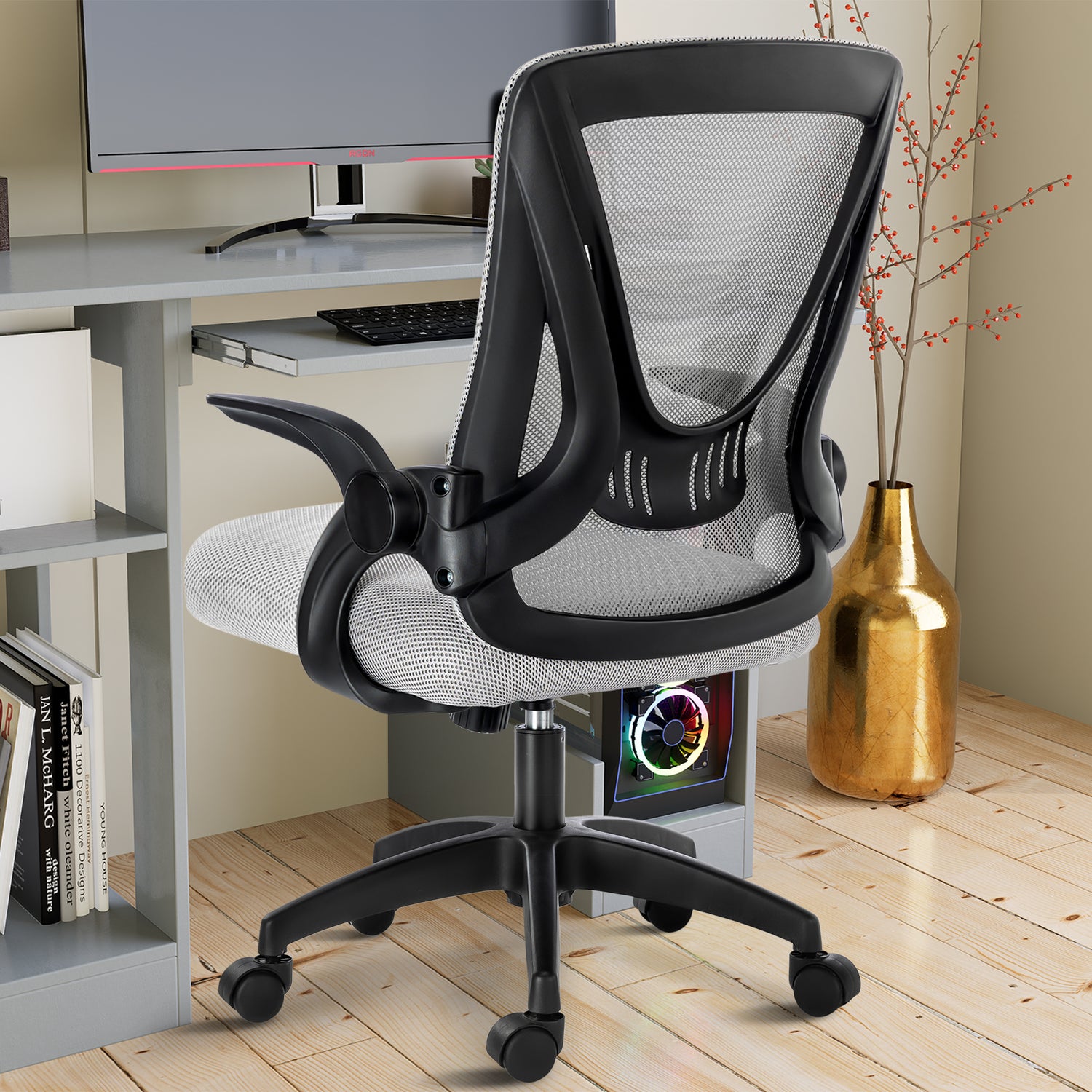 Grey office chair with mesh backrest, offering ergonomic support for long work sessions at your workstation.