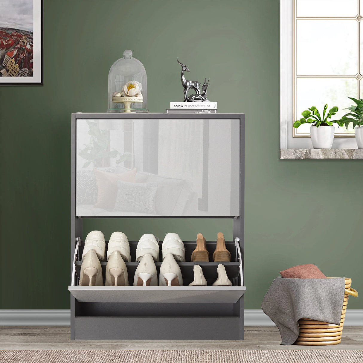 Front view of small shoe storage in two tone grey gloss, softly reflecting surrounding home décor of living room