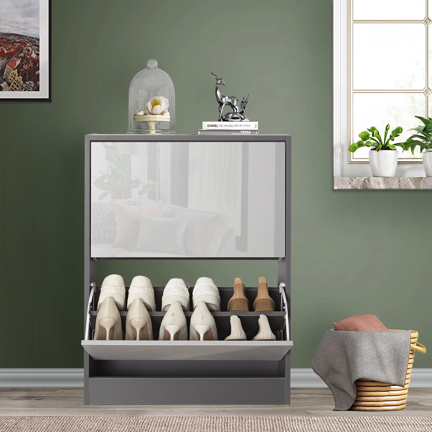Front view of small shoe storage in two tone grey gloss, softly reflecting surrounding home décor of living room