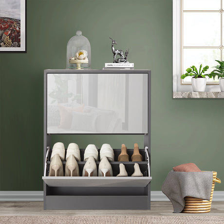 Front view of small shoe storage in two tone grey gloss, softly reflecting surrounding home décor of living room