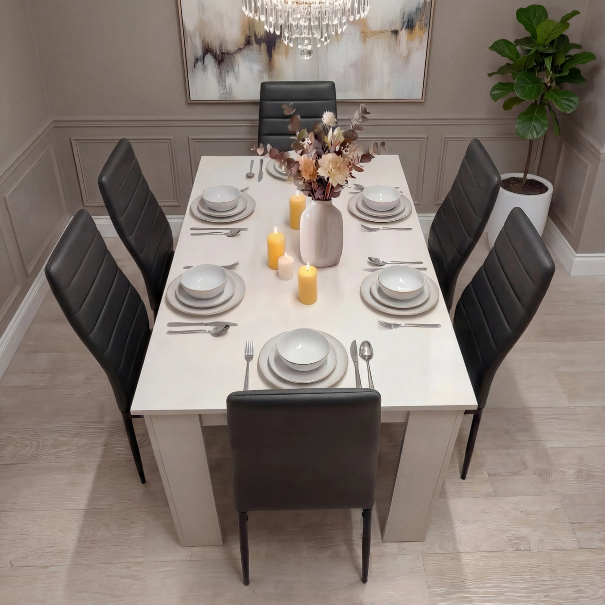 Elegant dining setup with white table and 6 black PU leather chairs, candles, and neutral decor. Ideal for modern dining rooms.