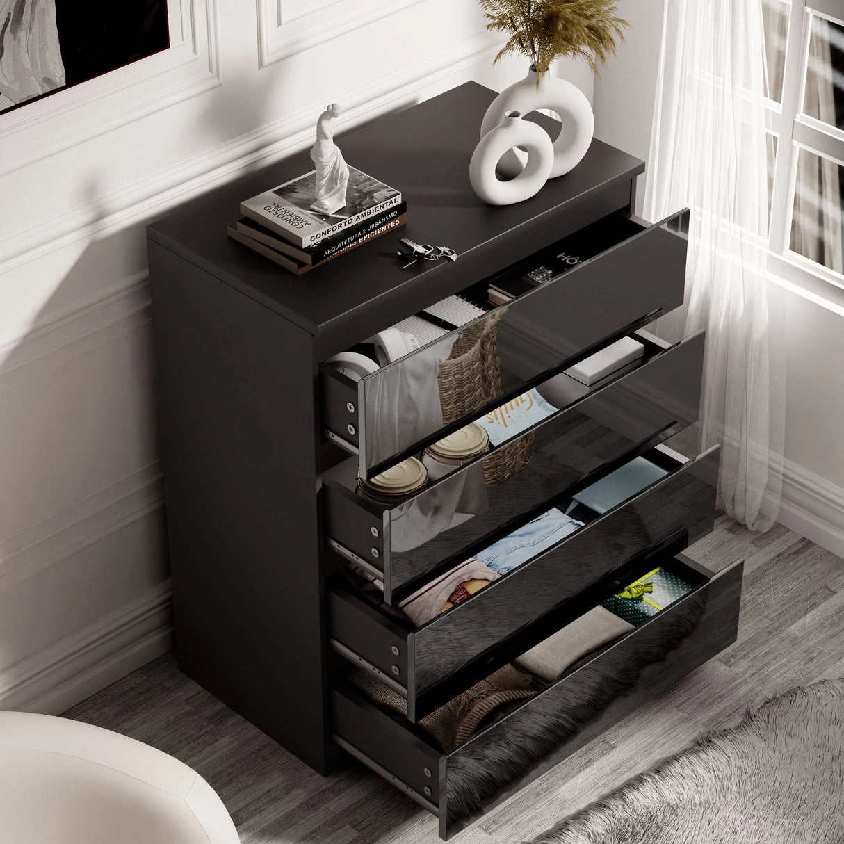 Black High Gloss 4 Drawer Chest of Drawers open with neatly organized clothes, perfect for modern bedroom organization.