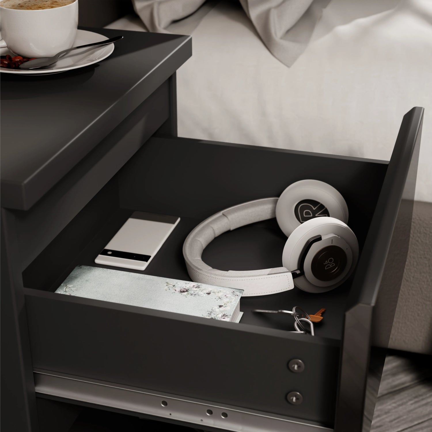 High Gloss 2 Drawer Bedside Table in black with open drawer showing headphones, phone, wallet, and keys. Sleek nightstand for modern bedroom storage.