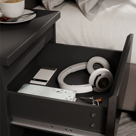 High Gloss 2 Drawer Bedside Table in black with open drawer showing headphones, phone, wallet, and keys. Sleek nightstand for modern bedroom storage.