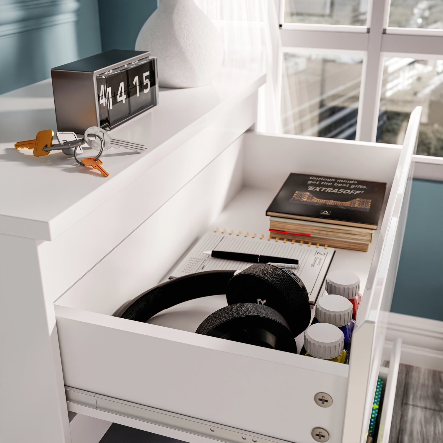 High Gloss 3 Drawer Chest of Drawers in white with open top drawer showing headphones, books, and accessories in a modern bedroom setup.