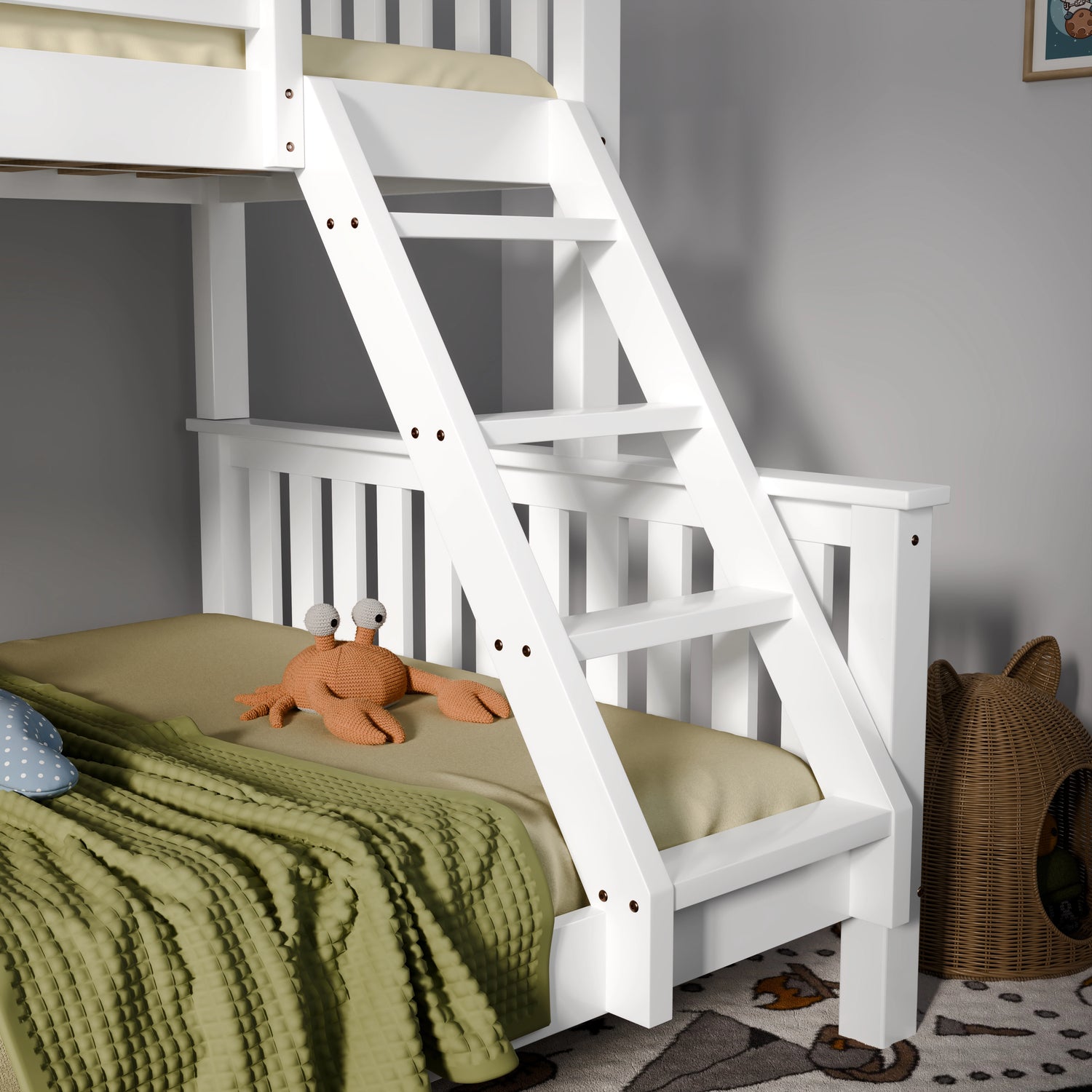 White wooden bunk bed with green bedding and a plush toy in a room.