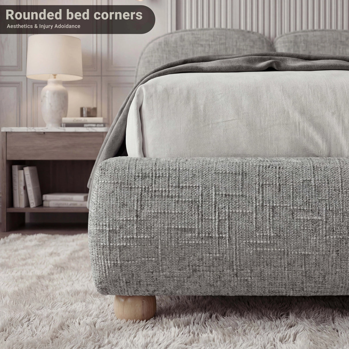 Grey king size low bed frame with a soft upholstery and a simple footboard, offering a cozy and modern aesthetic