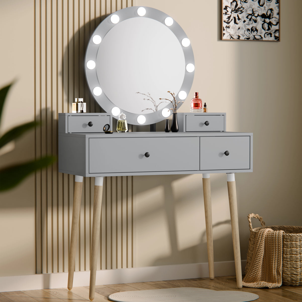 Gray vanity table with round mirror and lights in a room setting.