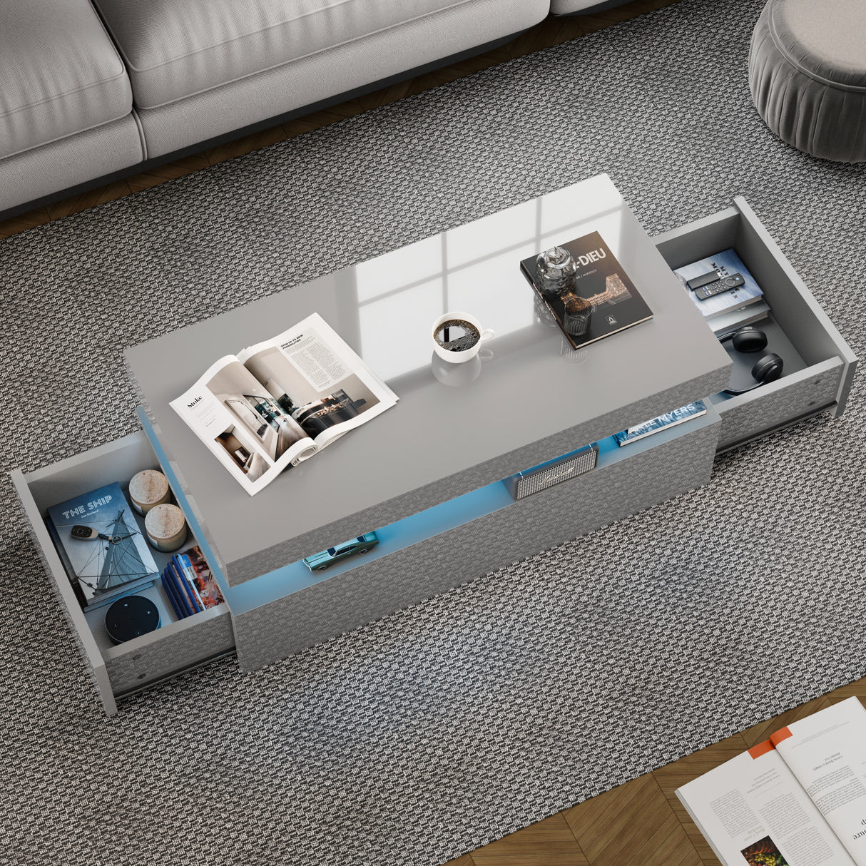 Gray coffee table with open drawers in a living room setting