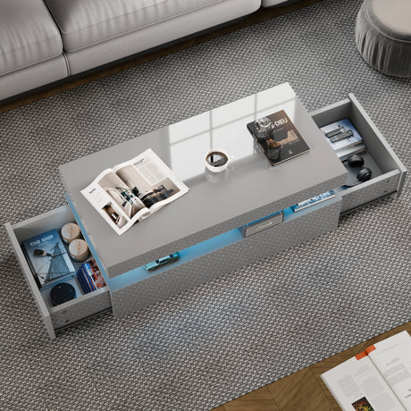 Gray coffee table with open drawers in a living room setting