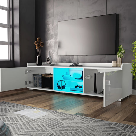 Modern living room with a white entertainment console, TV, and decorative items.