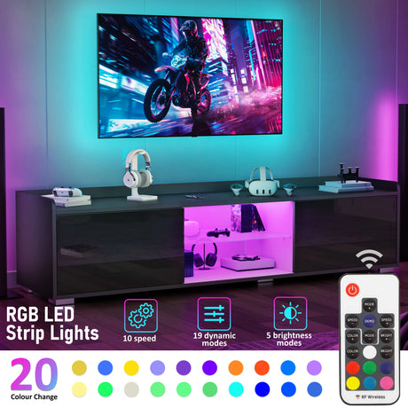 Modern entertainment console with RGB LED strip lights, TV, and gaming accessories.