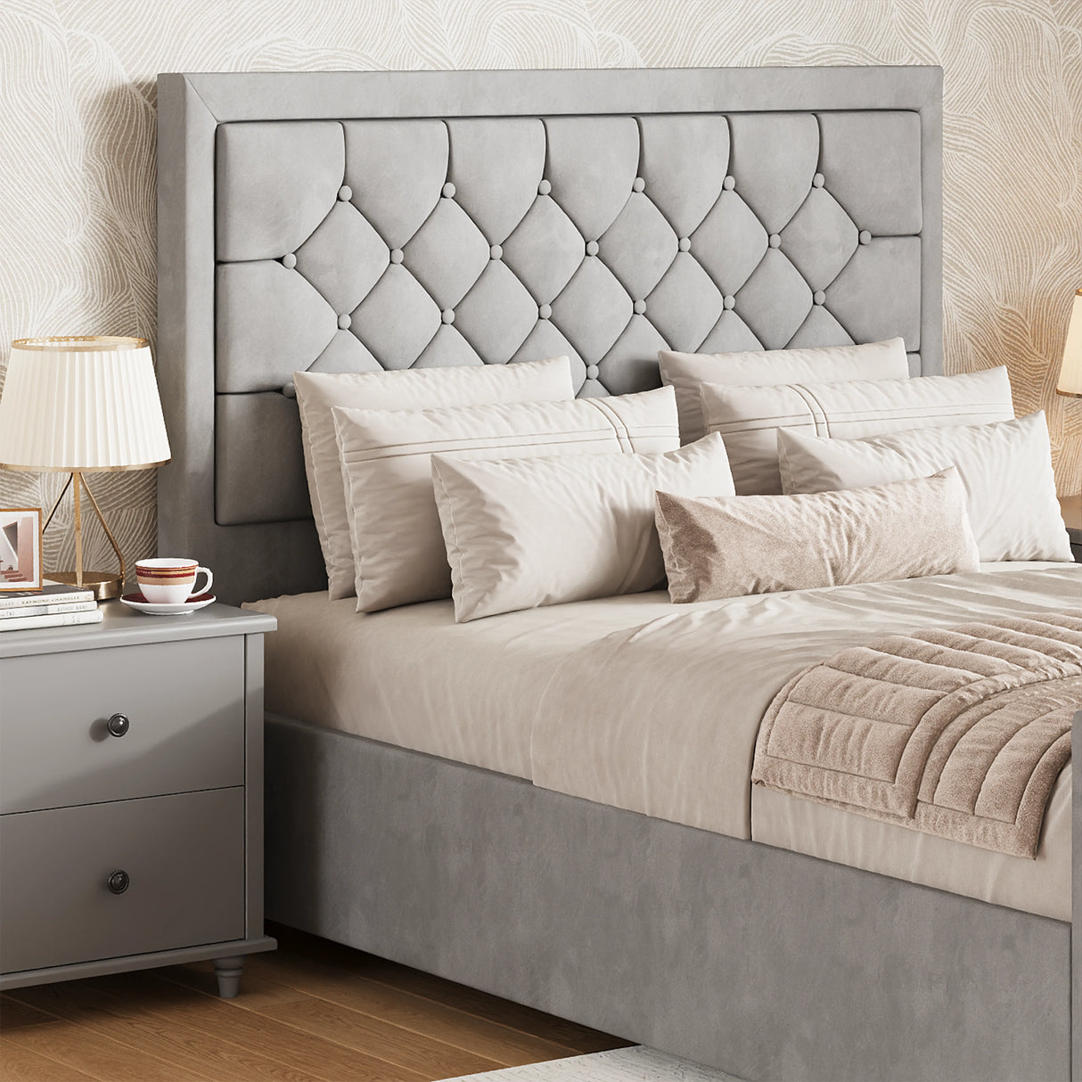 Light grey double storage bed with cross-puffed headboard positioned next to a modern bedside table