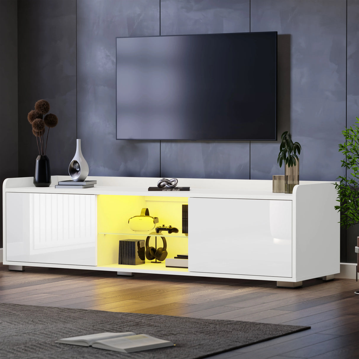 Modern living room with a white entertainment console, TV, and decorative items.