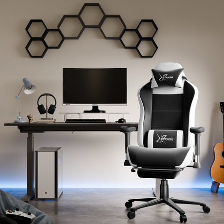 Modern gaming setup with a chair, desk, and computer monitor in a room.