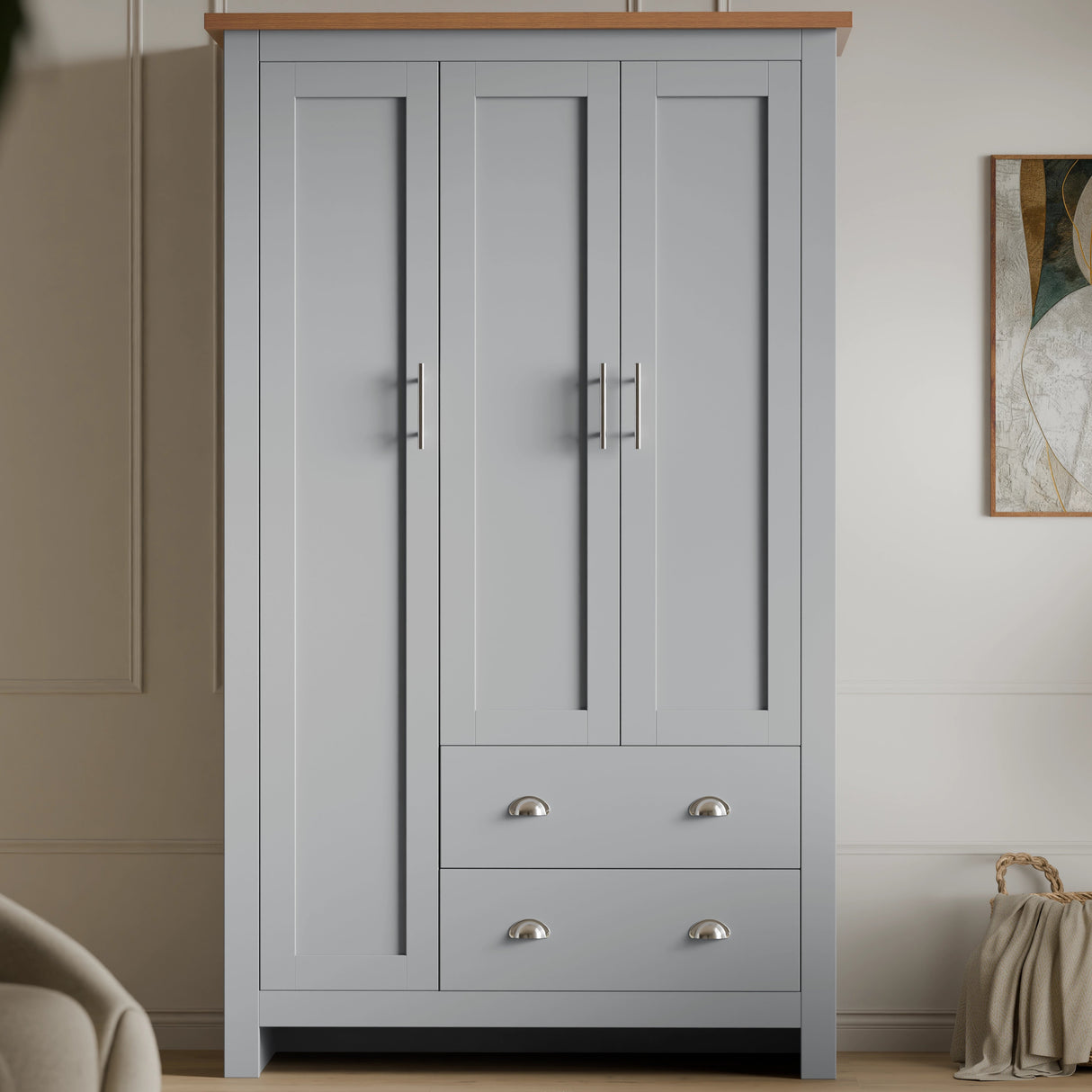 front view of grey shaker triple wardrobe with shelves and drawers with wooden top, placed against a wall in a bedroom