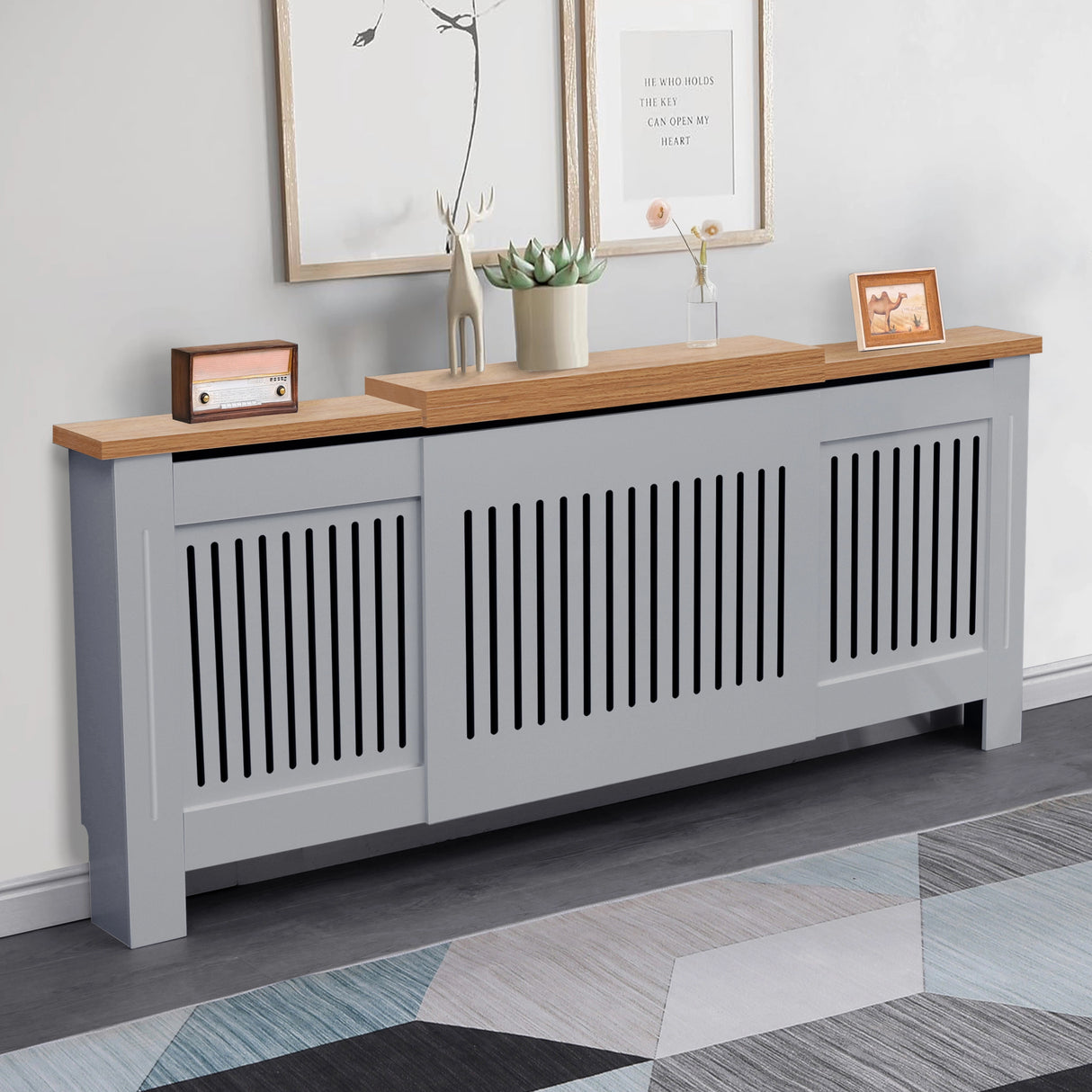 styled front angle of adjustable radiator cover in grey oak finish placed in a softly lit living room corner