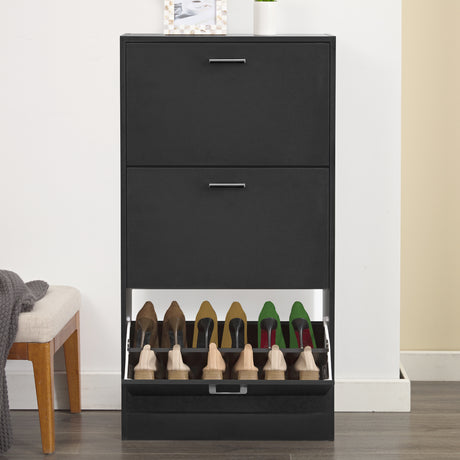 Captured from a front angle, this shoe cabinet hallway unit has its bottom drawer open, revealing six pairs of shoes.